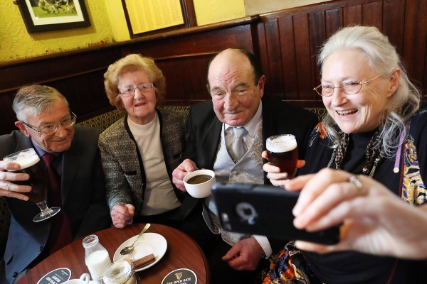 Pic Maxwells/Julien Behal No Fee 9/03/17 Dublin publicans have launched a new charity initiative with ALONE to mark the bicentenary of the Licensed Vintners Association (LVA).  The publicans have an ambition to raise €200,000 for ALONE’s ‘Befriending Services’. ALONE, which celebrates its 40th anniversary this year, is a national organisation that supports older people to age at home by providing community engagement programmes and other services to address social isolation among the elderly. The charity depends on public support to carry out its work with 100% of all donations going directly to the services it provides. Pictured launching the initiative at The Two Sister’s Pub in Terenure are Noel Murphy (Kilmainham) centre Annette Egan (Ranelagh) on right taking the ‘selfie’ Anne McAuley (Terenure) and Tony McCarthy from Kilmainham.  Pic Maxwells/No Fee