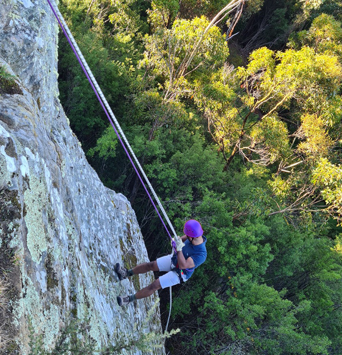 Person abseiling down Dalkey Quarry