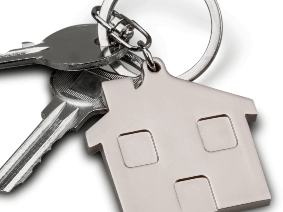 House-shaped keyring attached to a set of door keys