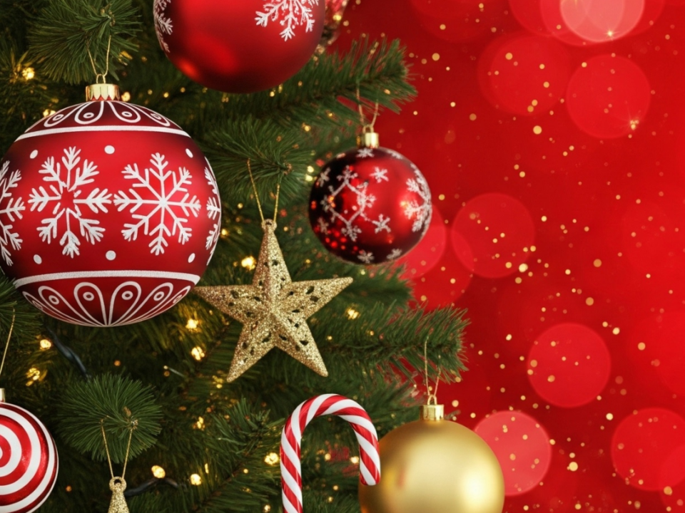 Christmas tree with red and gold baubles, glitter stars and a candy cane, with the text "#ShareYourWarmth"