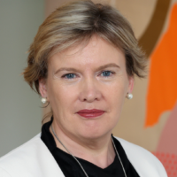 Eimear Cahalin Eimear Cahalin, wearing a white blazer over a black top, smiling in a portrait photo